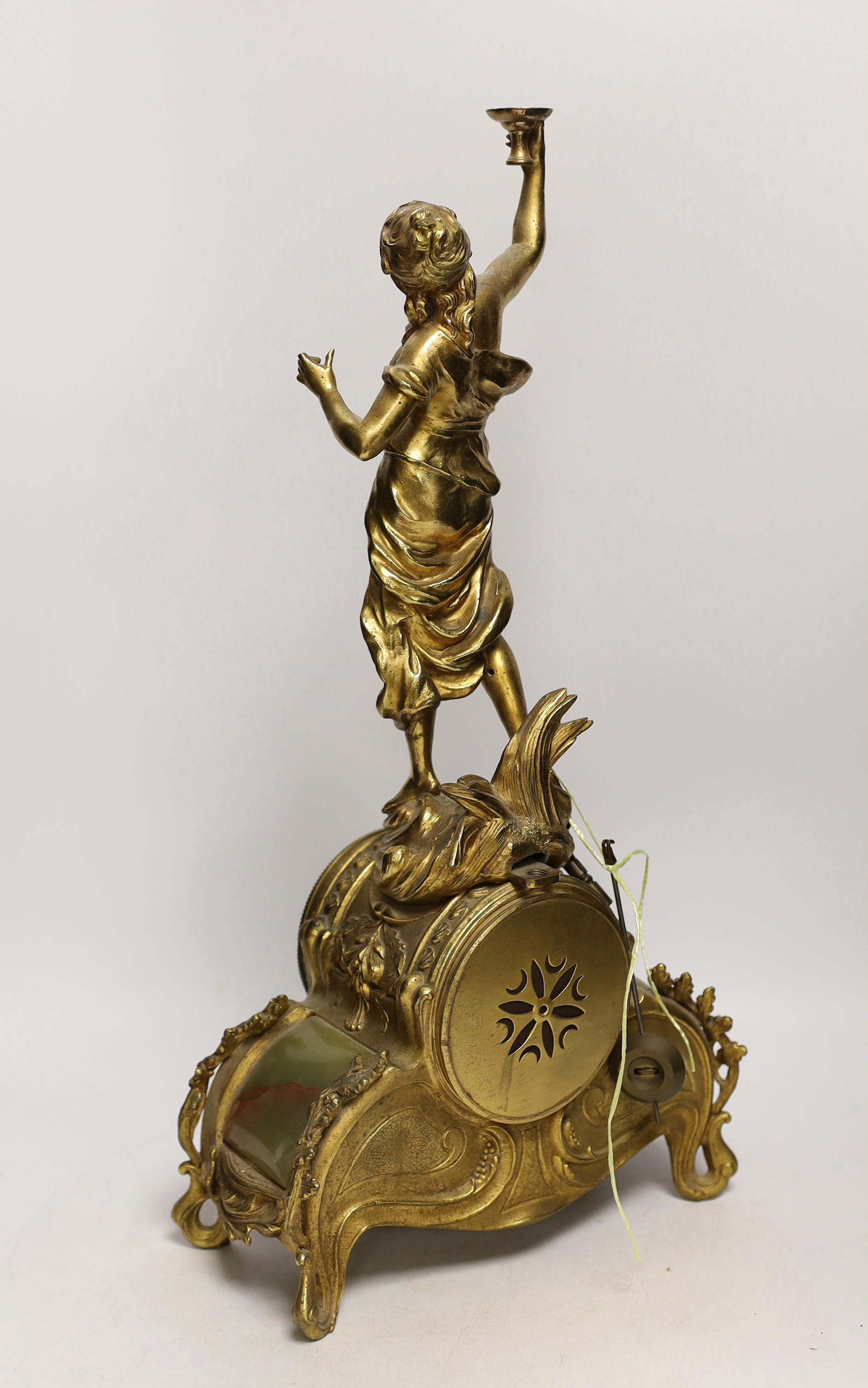 A French figurative gilt metal and green onyx mantel clock with hand painted dial, 51cm high